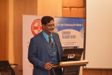 Dr. Prakash Kurmi receiving recognition for his contributions to healthcare, diabetes awareness, and social service initiatives in India.