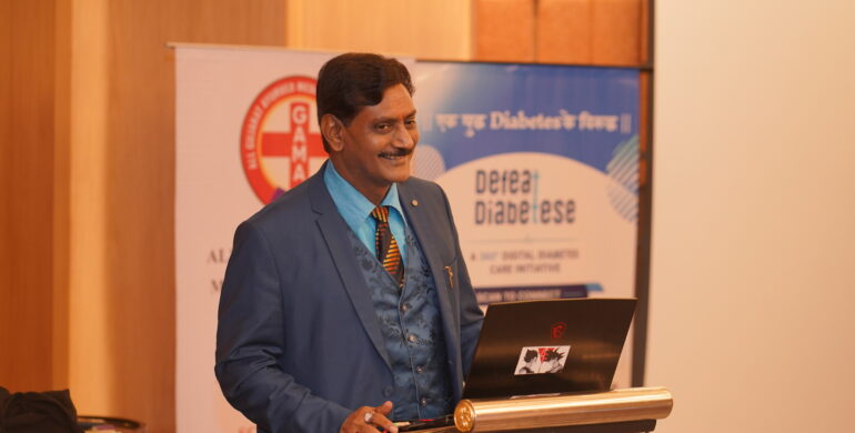 Dr. Prakash Kurmi receiving recognition for his contributions to healthcare, diabetes awareness, and social service initiatives in India.