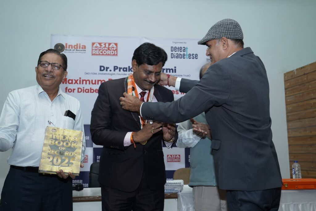 Dr. Prakash Kurmi, MBBS, MD (Medicine), FIDM (Senior Diabetologist), being honored for his exceptional contribution to healthcare and social welfare. As the Founder of Shivam Charitable Trust and DEFEAT DIABETESE – “એક યુદ્ધ ડાયાબિટીસ વિરુદ્ધ”, he has dedicated over 30 years to diabetes care, community healthcare, BSF welfare initiatives, educational support programs, and public health awareness campaigns, positively impacting more than 100,000 lives across India.