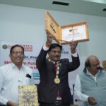 Dr. Prakash Kurmi receiving an award in recognition of his outstanding contribution to healthcare, diabetes awareness, and social service initiatives.