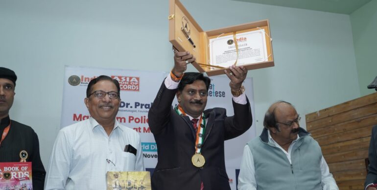 Dr. Prakash Kurmi receiving an award in recognition of his outstanding contribution to healthcare, diabetes awareness, and social service initiatives.