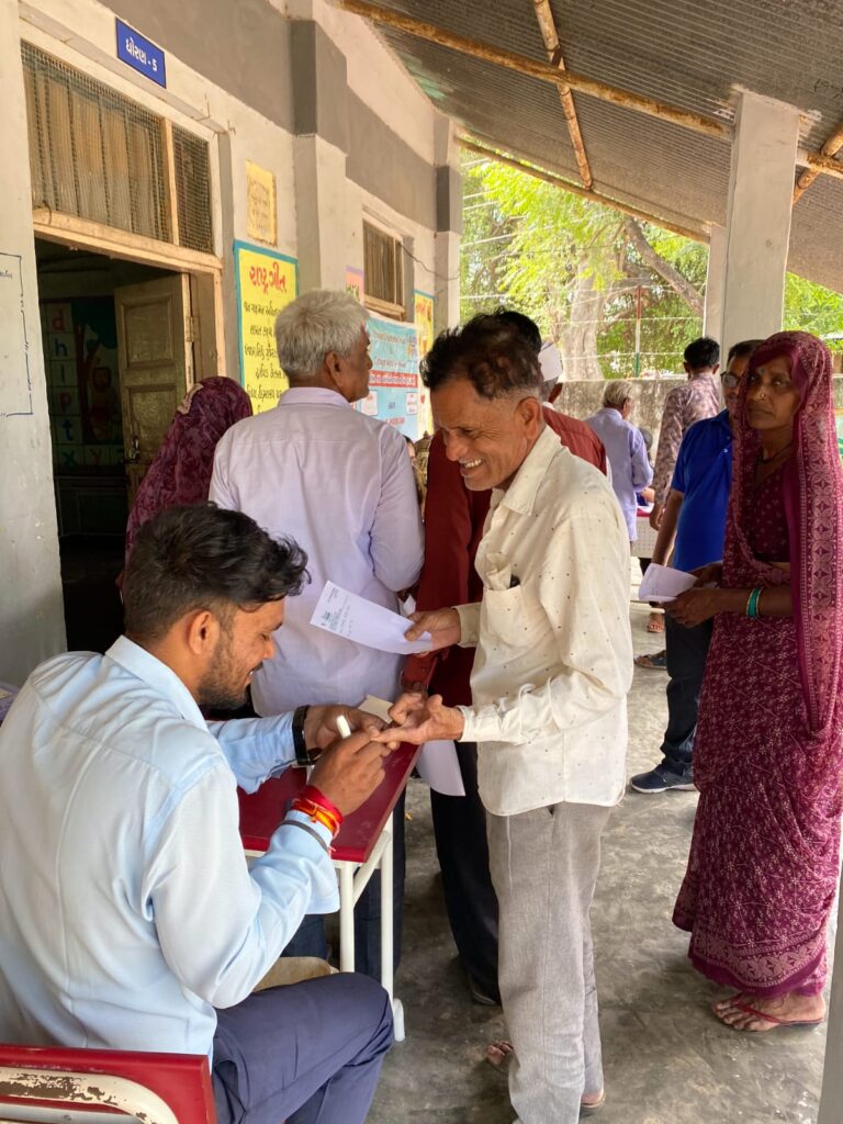 Mega Health Camp Sujana Muvada organized by Shivam Charitable Trust for free diabetes, BP, and eye check-up services in rural villages.
