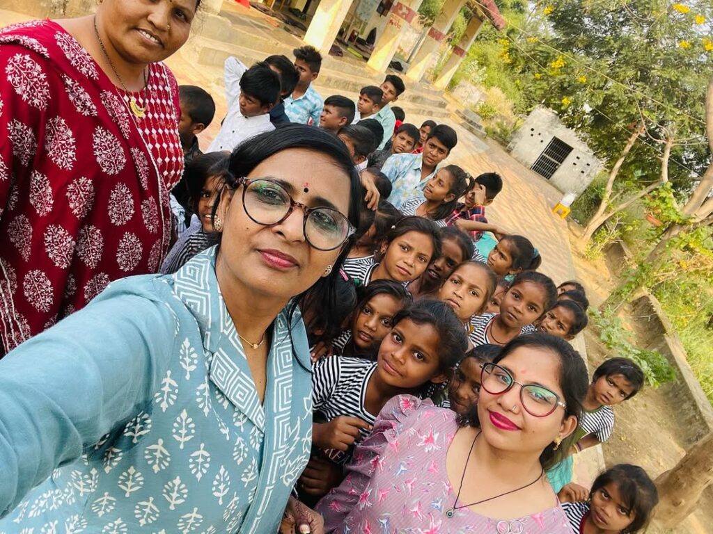 Shivam Charitable Trust distributing school bags, books, and educational kits to underprivileged children in Gujarat.Education Support for Underprivileged Children