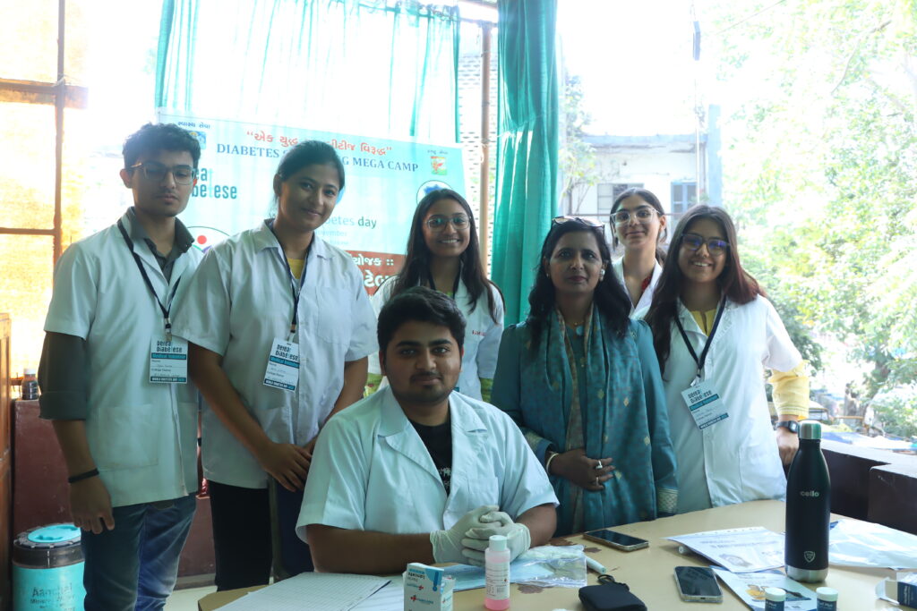 Medical volunteers conducting diabetes screening and patient registration during a DEFEAT DIABETESE health camp.
