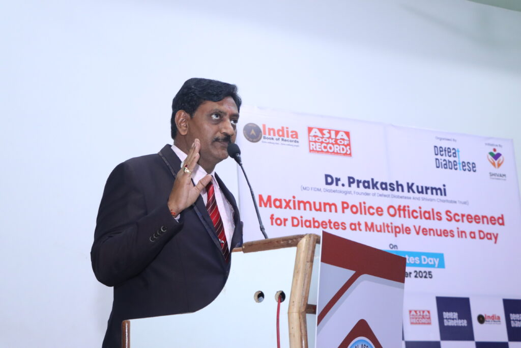 Dr. Prakash Kurmi addressing an audience during a healthcare awareness event organized by Shivam Charitable Trust and DEFEAT DIABETESE.