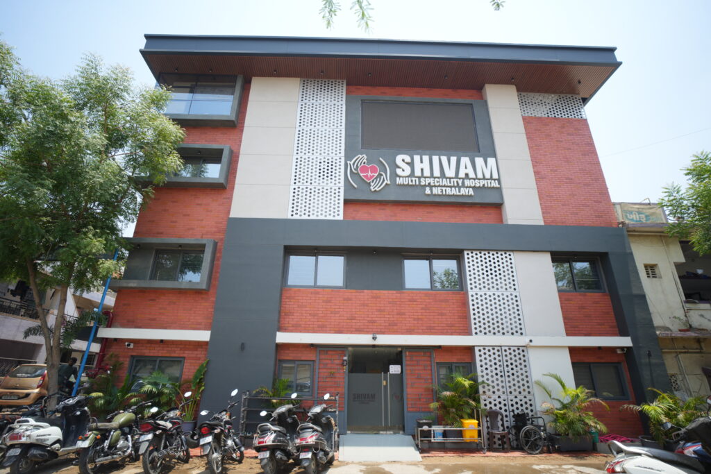 Shivam Multispeciality Hospital building in Ahmedabad providing advanced healthcare and monthly free health camps.