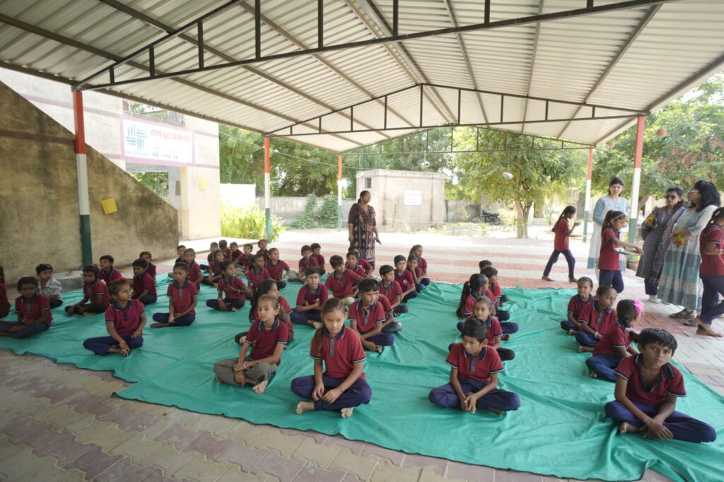 Shivam Charitable Trust and Rasna distribute 5,500 notebooks to school students in Patan