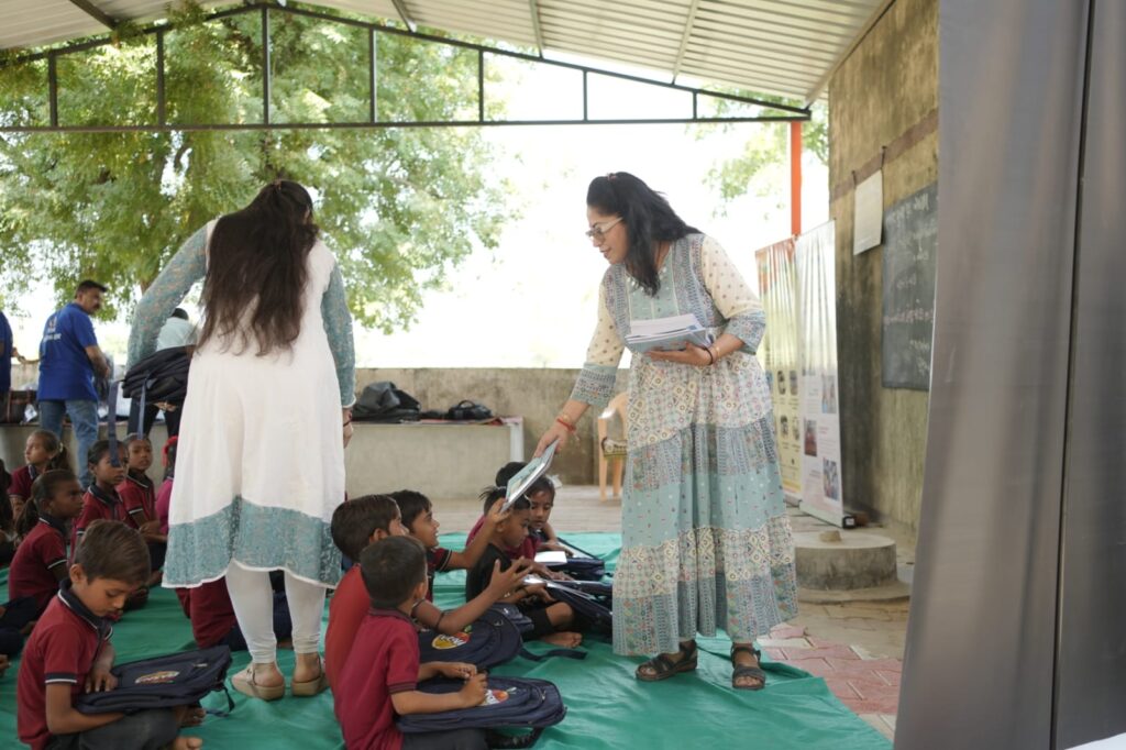 Shivam Charitable Trust and Rasna distribute 5,500 notebooks to school students in Patan