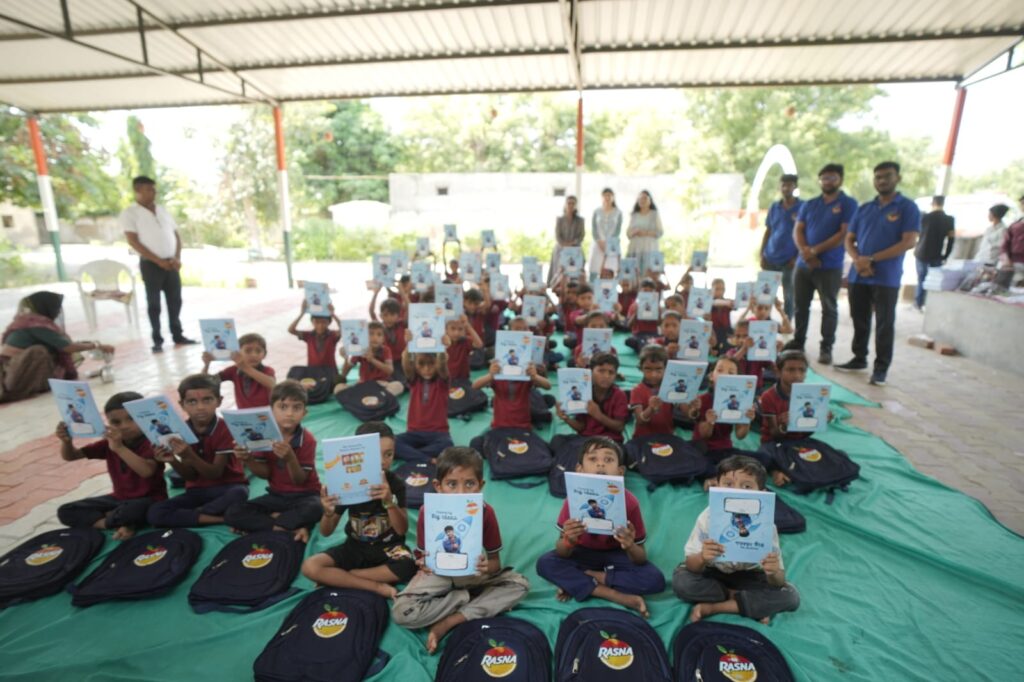 Shivam Charitable Trust and Rasna distribute 5,500 notebooks to school students in Patan