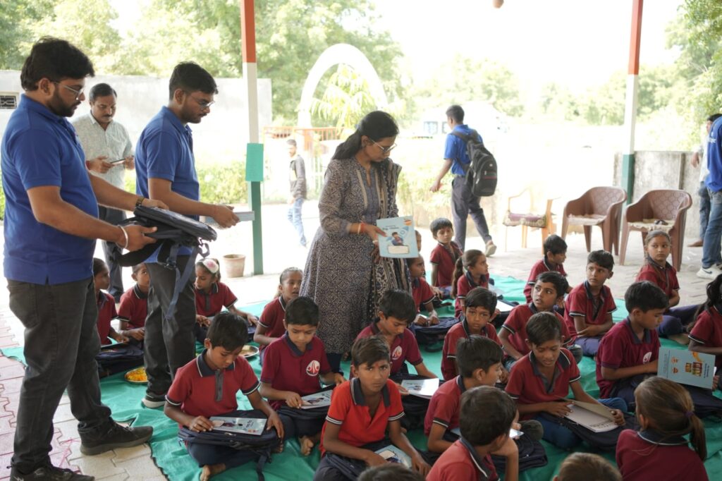 Shivam Charitable Trust and Rasna distribute 5,500 notebooks to school students in Patan