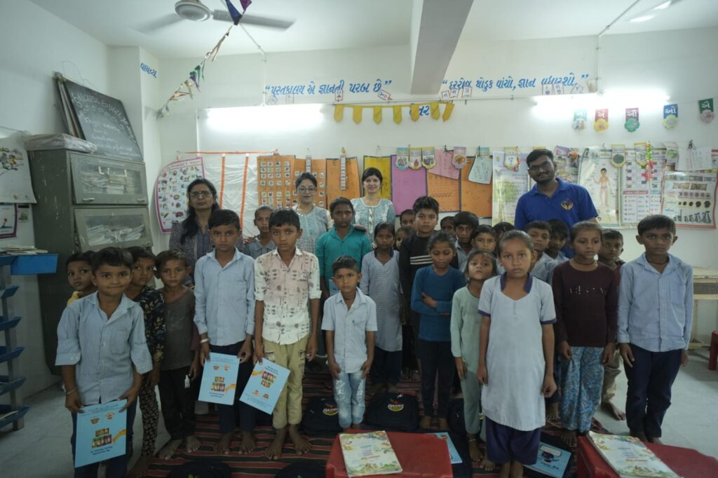 Shivam Charitable Trust and Rasna distribute 5,500 notebooks to school students in Patan