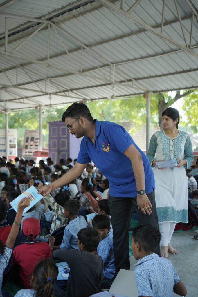 Shivam Charitable Trust and Rasna distribute 5,500 notebooks to school students in Patan