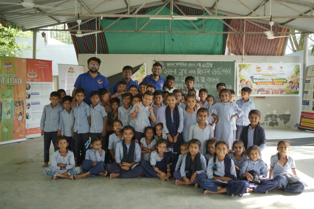 Shivam Charitable Trust and Rasna distribute 5,500 notebooks to school students in Patan
