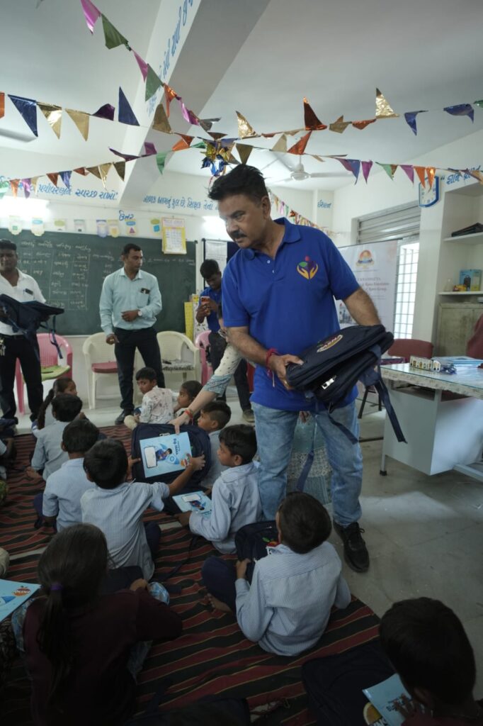 Shivam Charitable Trust and Rasna distribute approximately 450 bags in Patan, Gujarat, as part of a community welfare initiative.