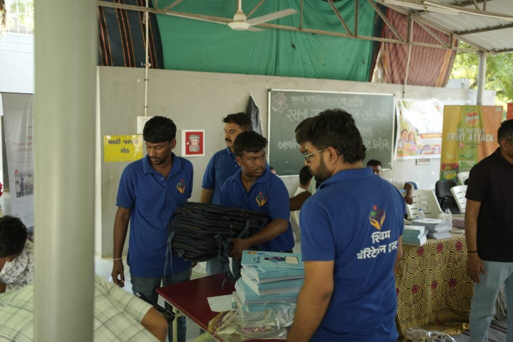 Shivam Charitable Trust and Rasna distribute approximately 450 bags in Patan, Gujarat, as part of a community welfare initiative.